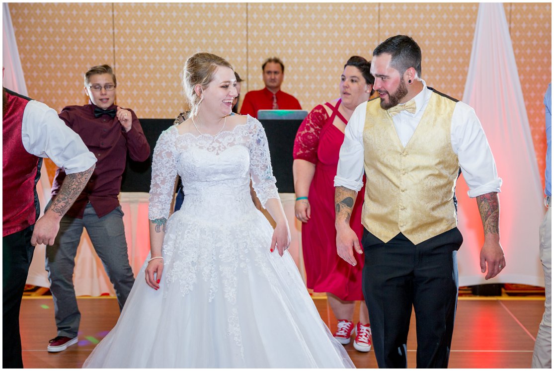 Red and Gold Cheyenne, Wyoming Wedding at Little America by Wyoming Photographer