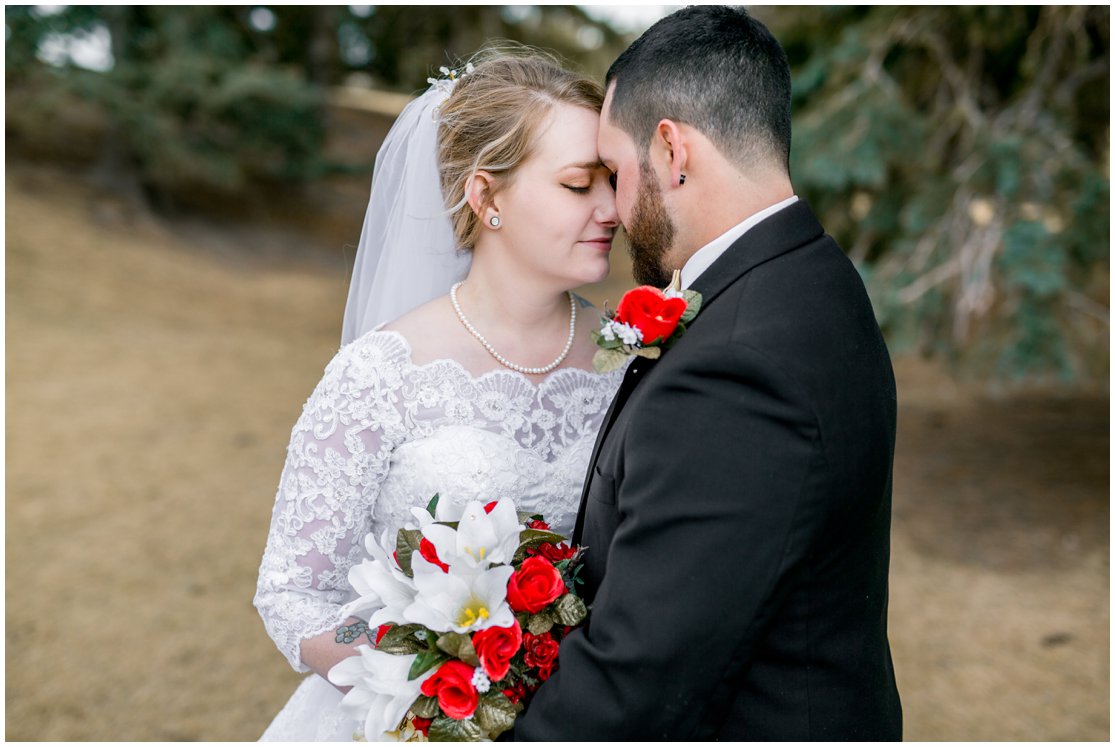 Red and Gold Cheyenne, Wyoming Wedding at Little America by Wyoming Photographer