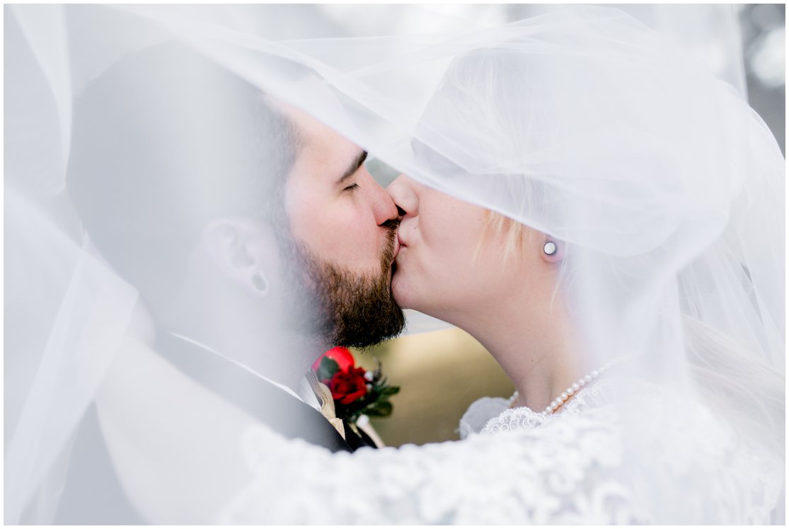 Red and Gold Cheyenne, Wyoming Wedding at Little America by Wyoming Photographer