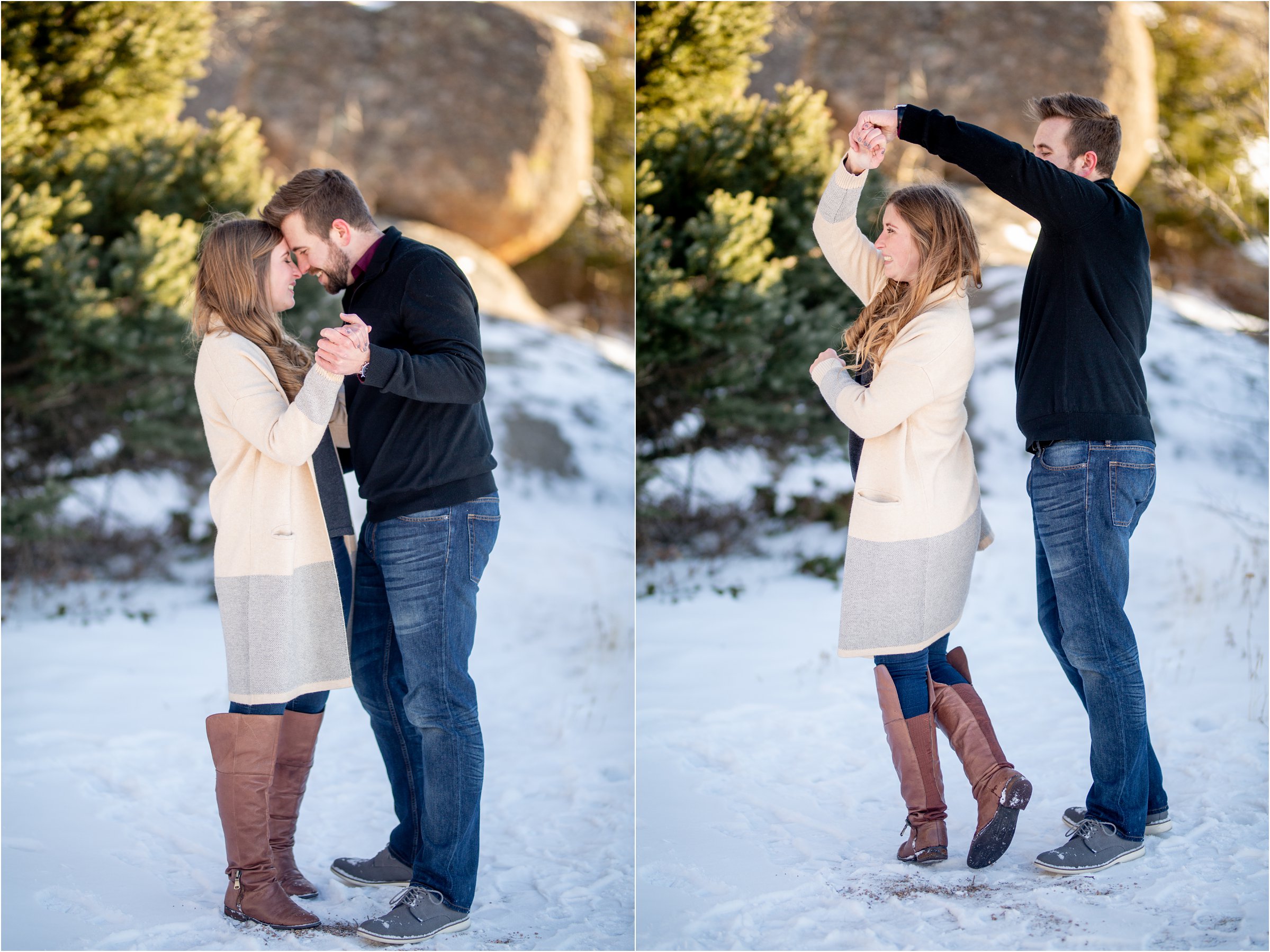 engaged couple dancing in the snow together with rocks and trees in the background