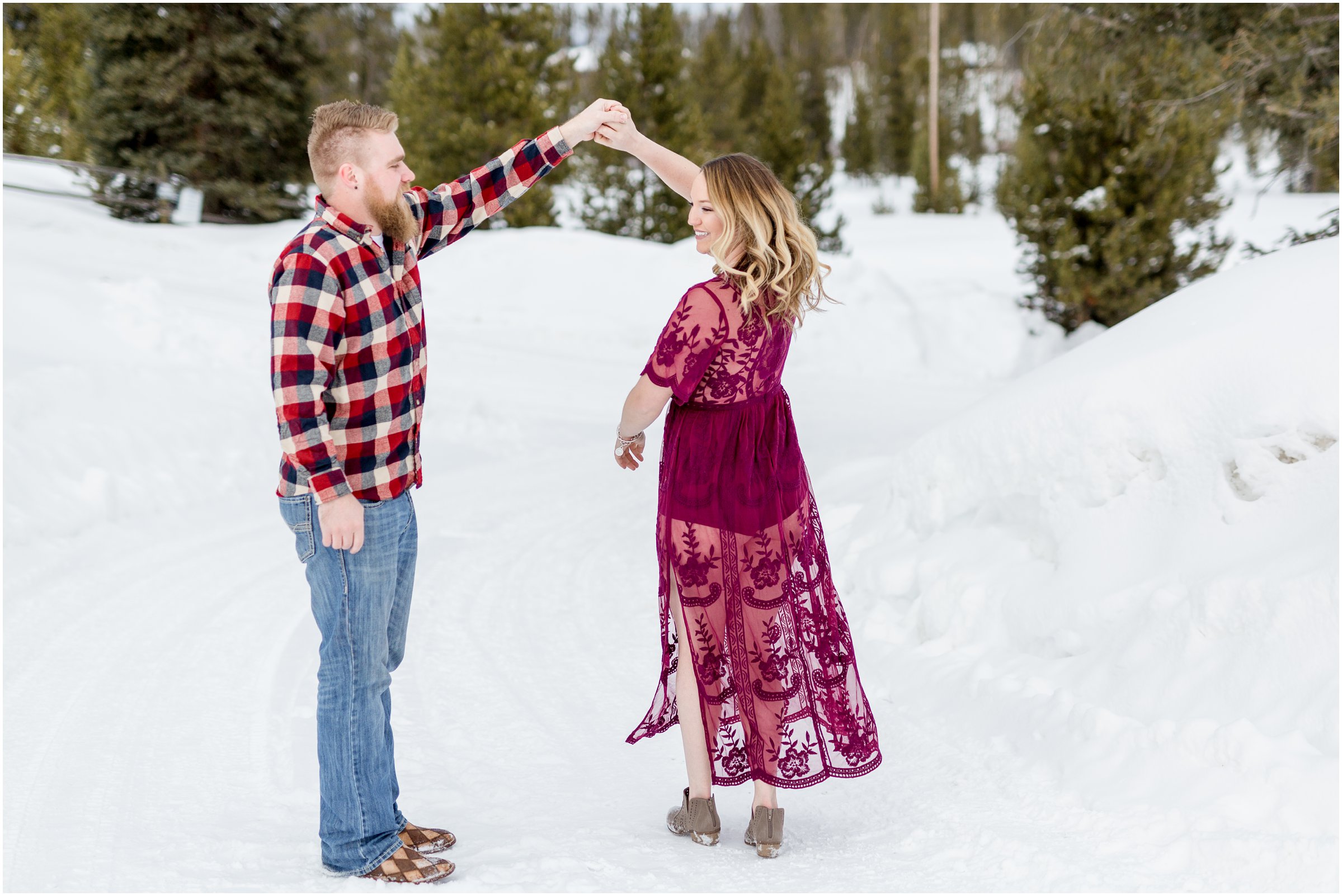 man in plaid and woman in red lace dress stand face to face for photos with their grand lake wedding photographer