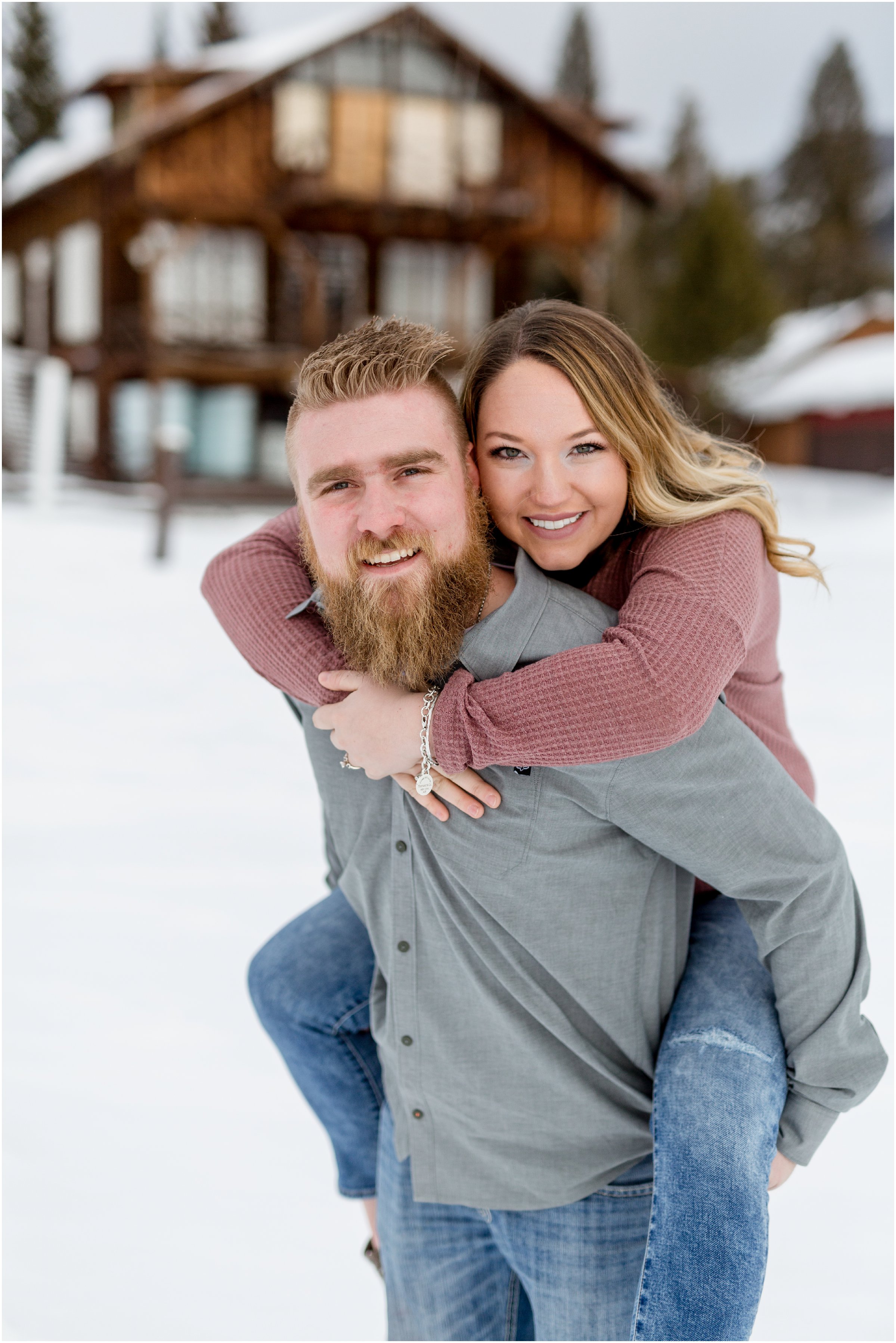 bride and groom stand on grand lake and pose for a photo with their grand lake wedding photographer