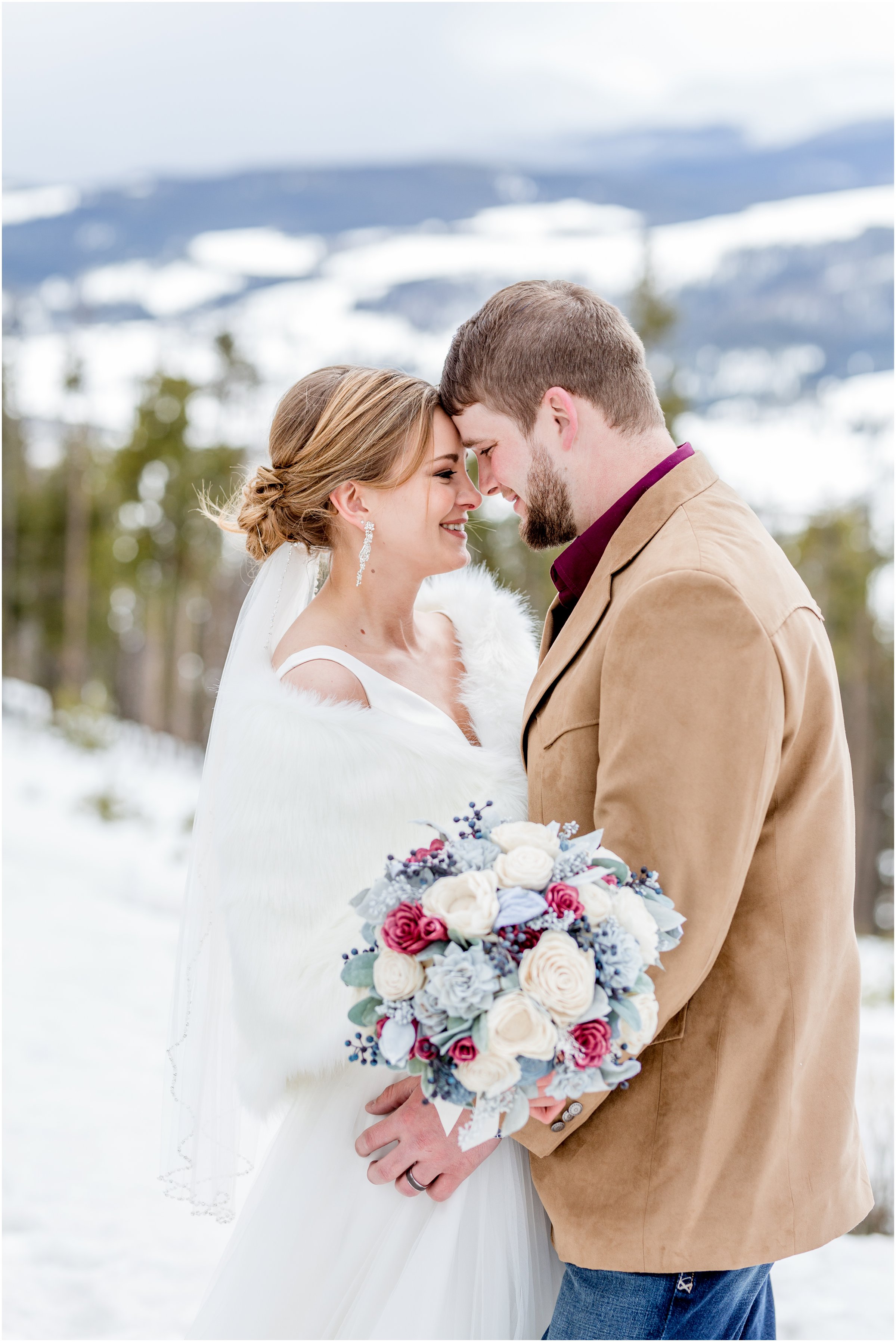 winter wedding in Silverthorne Colorado with snow around Lake Dillon