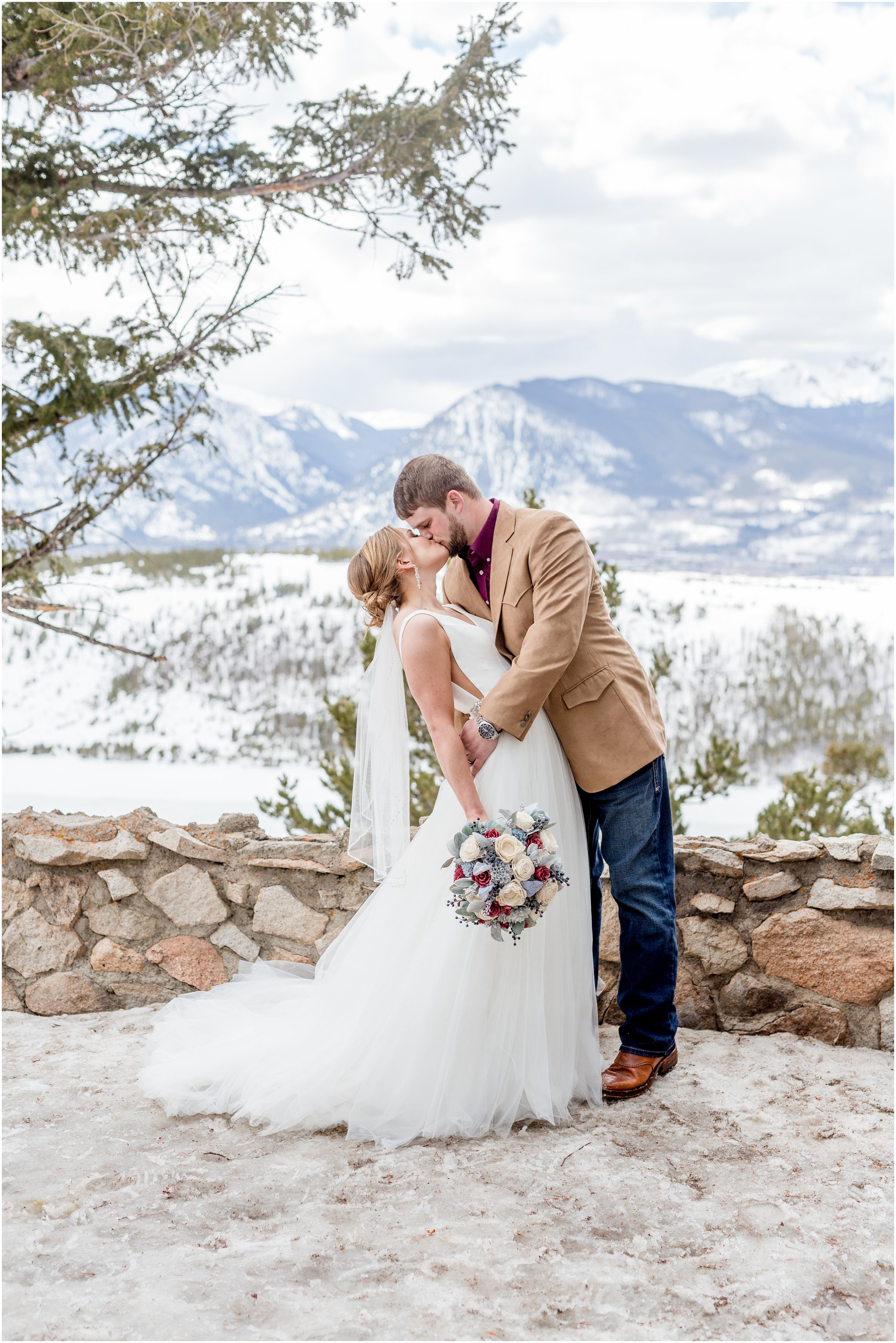 winter wedding in Silverthorne Colorado with snow around Lake Dillon