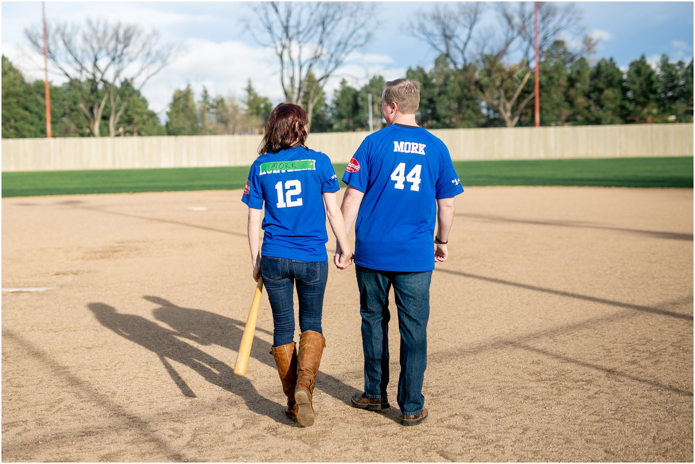 Engagement Session in Cheyenne Wyoming at Lions Park. Baseball themed with lots of flowers and blooming trees. 