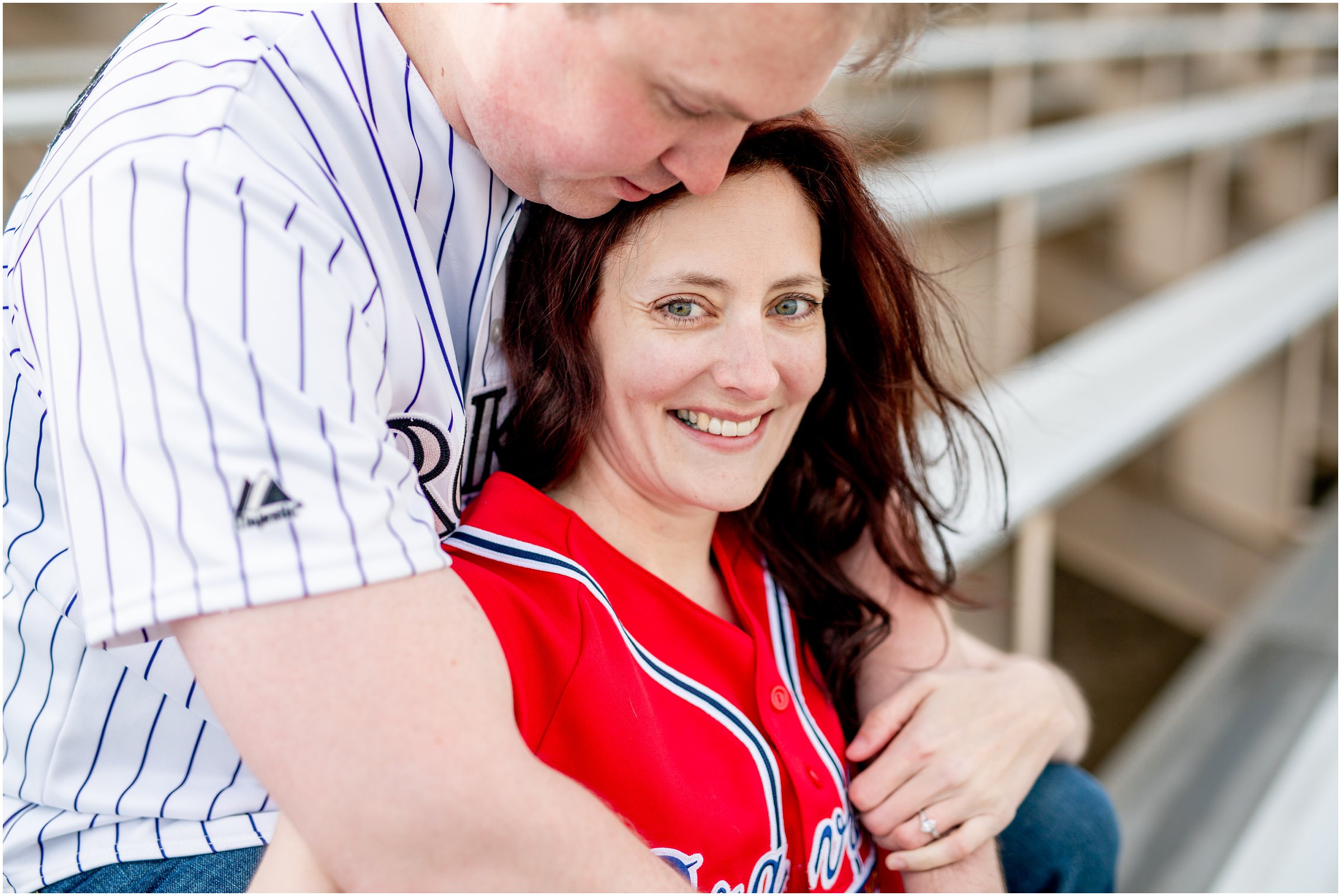 Engagement Session in Cheyenne Wyoming at Lions Park. Baseball themed with lots of flowers and blooming trees. 