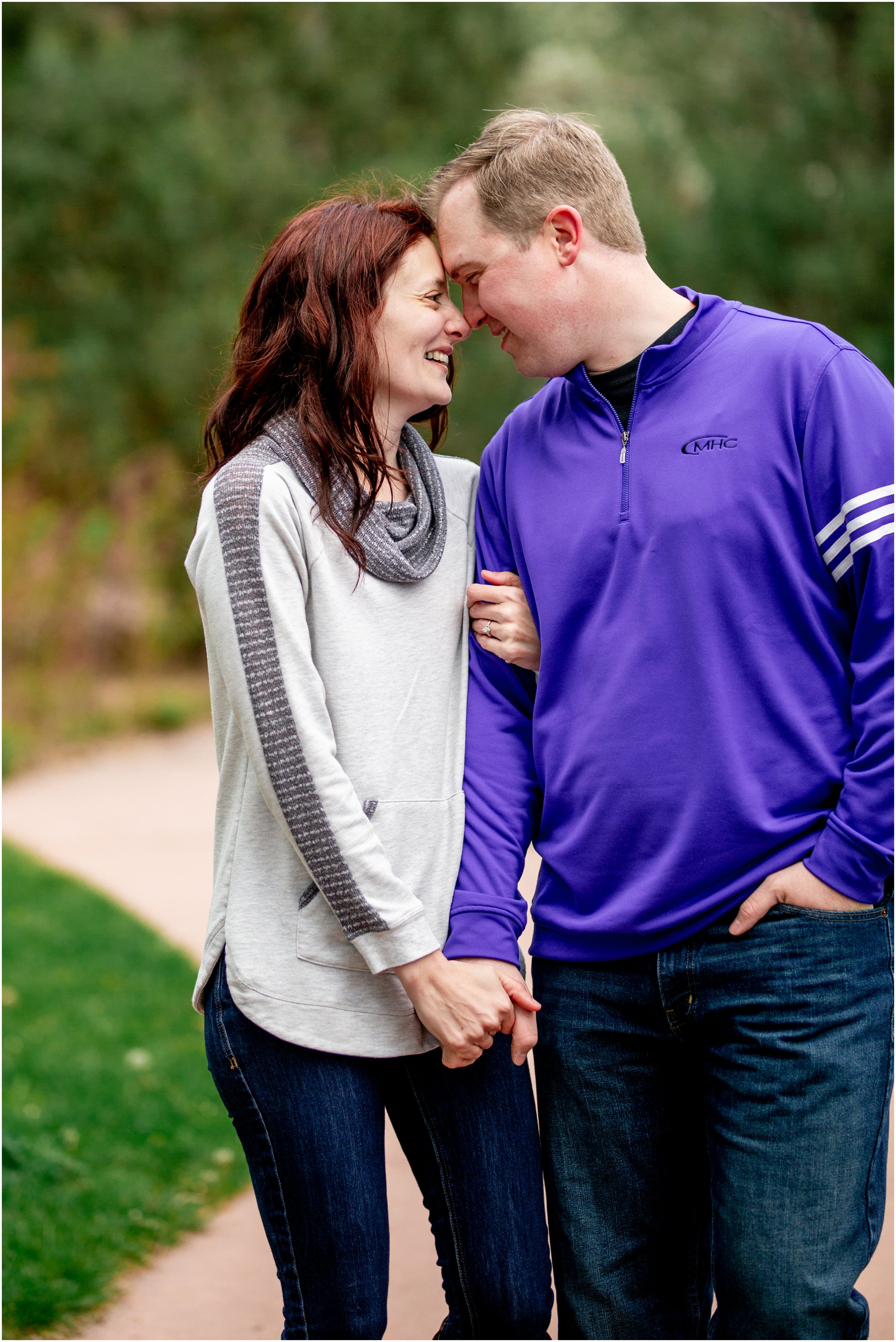 Engagement Session in Cheyenne Wyoming at Lions Park. Baseball themed with lots of flowers and blooming trees. 