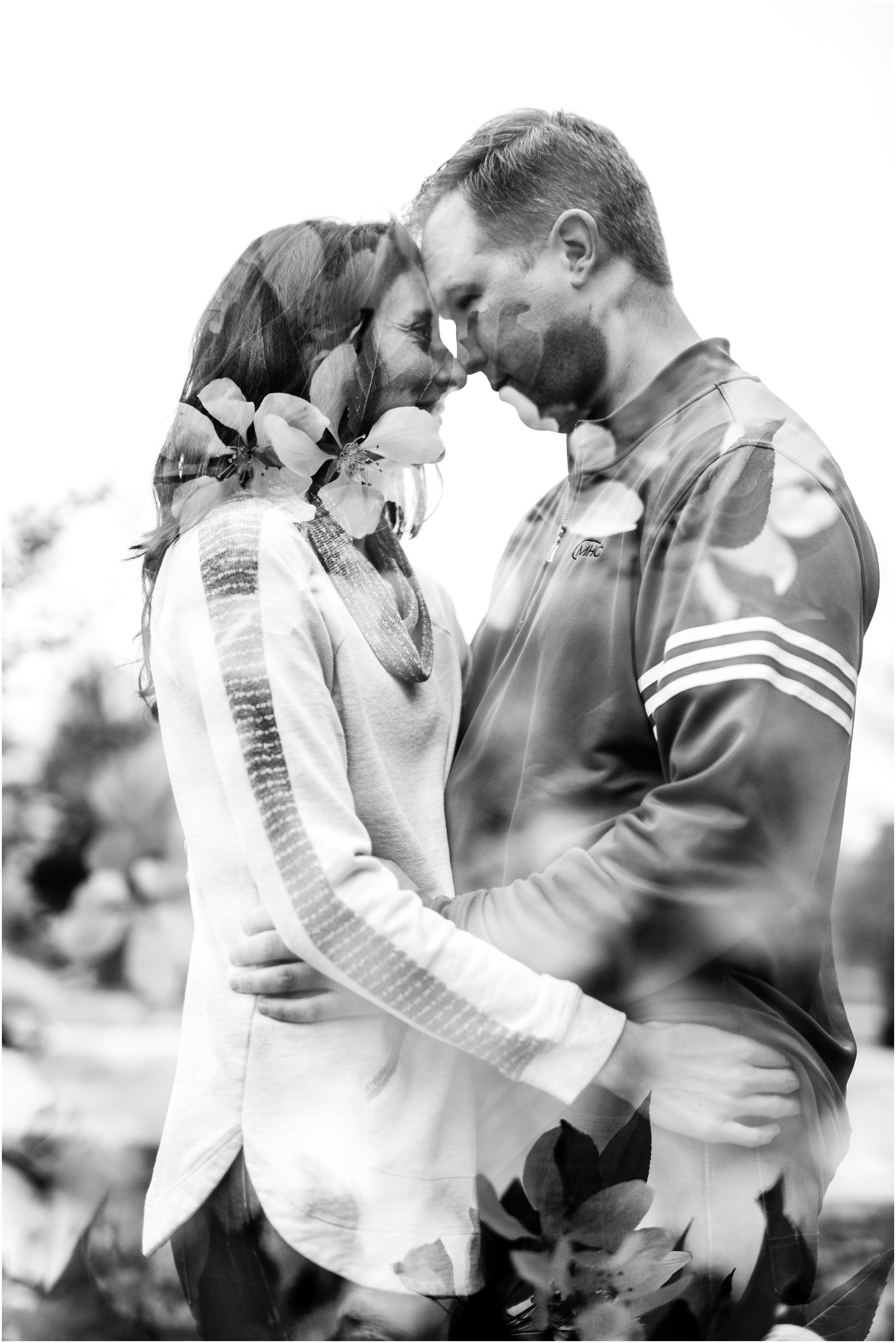 Engagement Session in Cheyenne Wyoming at Lions Park. Baseball themed with lots of flowers and blooming trees. 