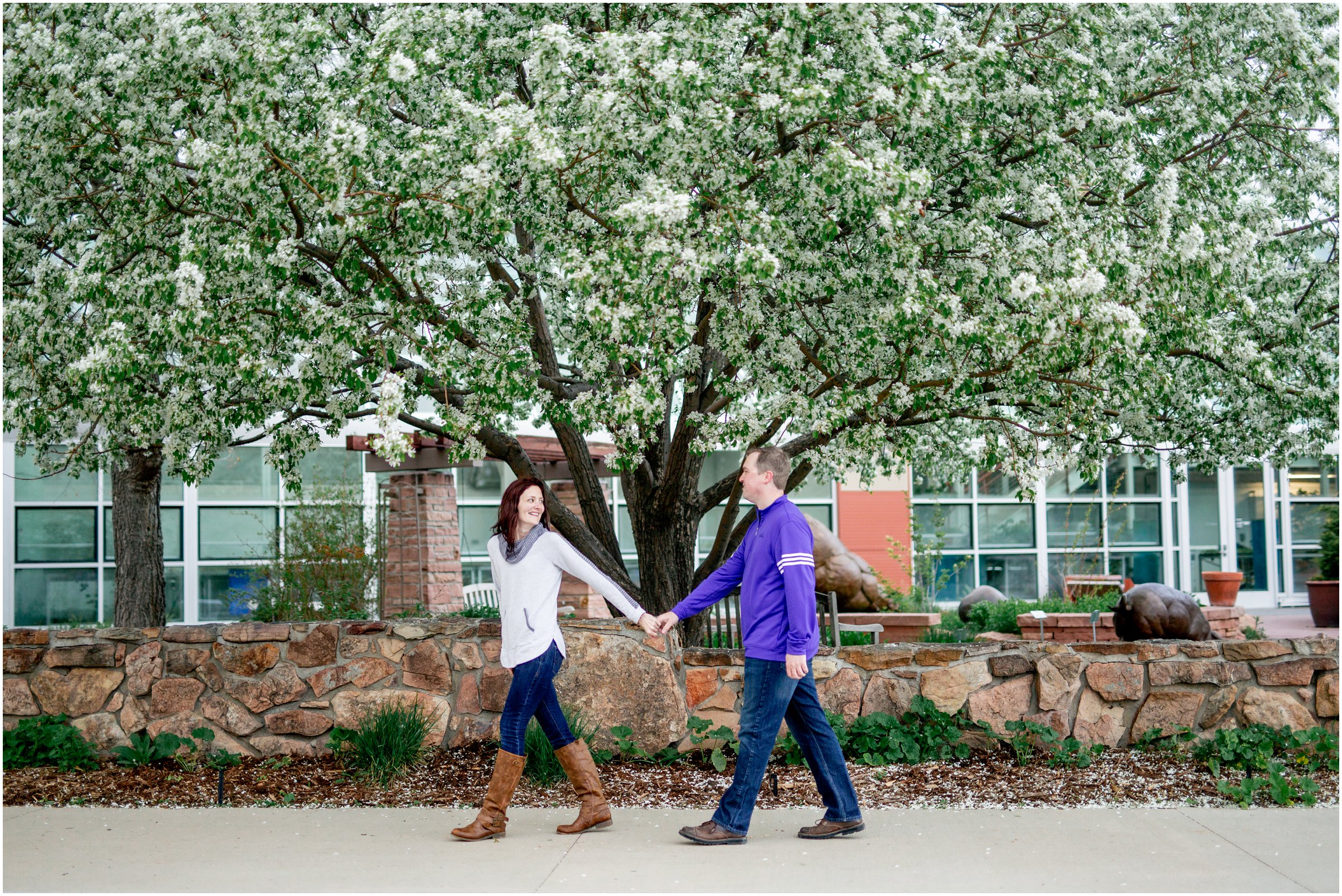 Engagement Session in Cheyenne Wyoming at Lions Park. Baseball themed with lots of flowers and blooming trees. 