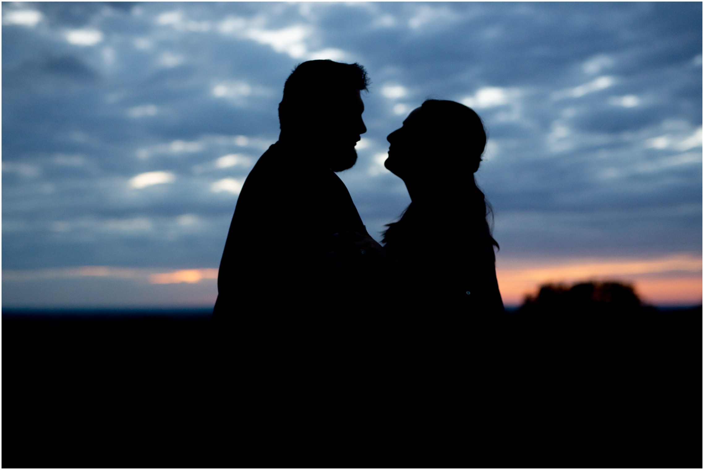 Silhouette of couple against a sunset
